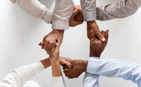 business-hands-joined-together-teamwork
